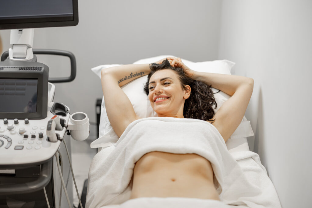 Woman during an ultrasound examination of abdominal cavity